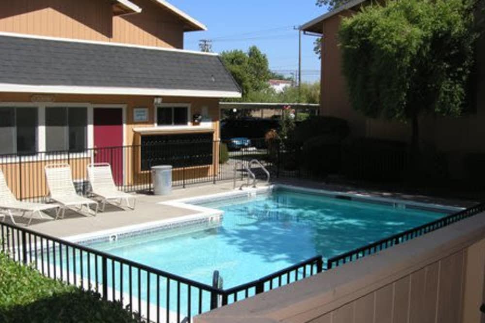 Apartment home next to swimming pool at Arden Bell Apartments in Sacramento, California