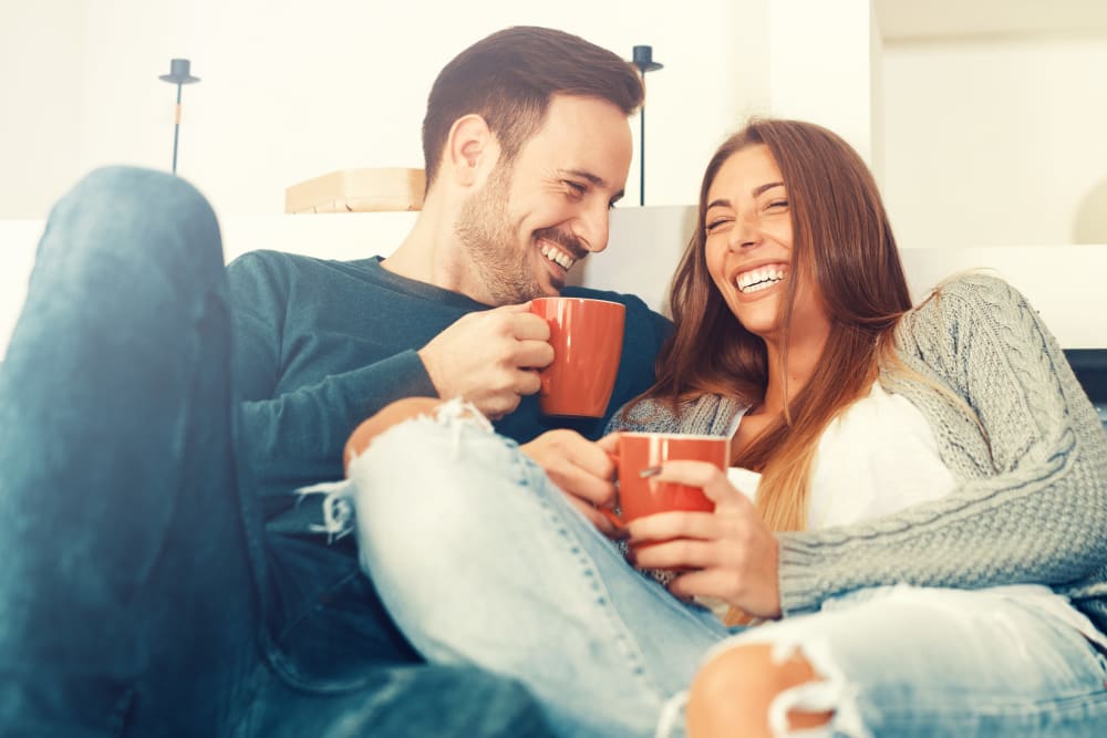 Couple enjoying a cup of coffee at Augusta Woods in Sacramento, California