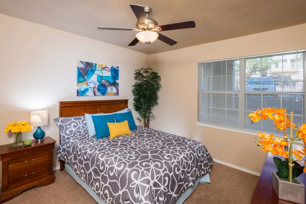 Bedroom with lighted ceiling fan at Mira Vista at La Cantera