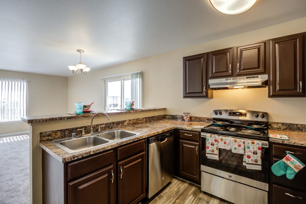 Kitchen with Modern Appliances at Belle Creek Apartments in Henderson, Colorado