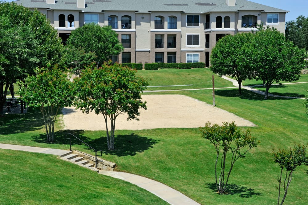 Sand volleyball court at Ballantyne Apartments in Lewisville, Texas