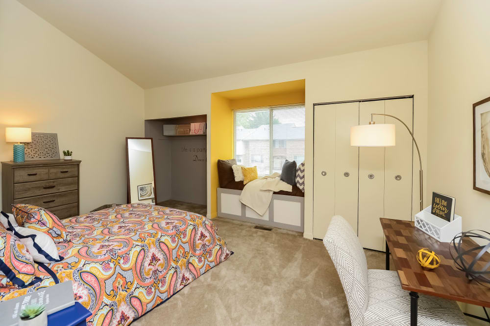 Spacious bedroom with a window bench seat and plenty of closet space at Briarwood Apartments & Townhomes in State College, Pennsylvania