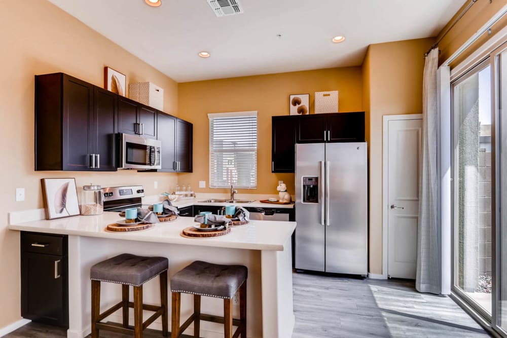 Fully-equipped kitchen and breakfast bar at Avilla Deer Valley in Phoenix, Arizona