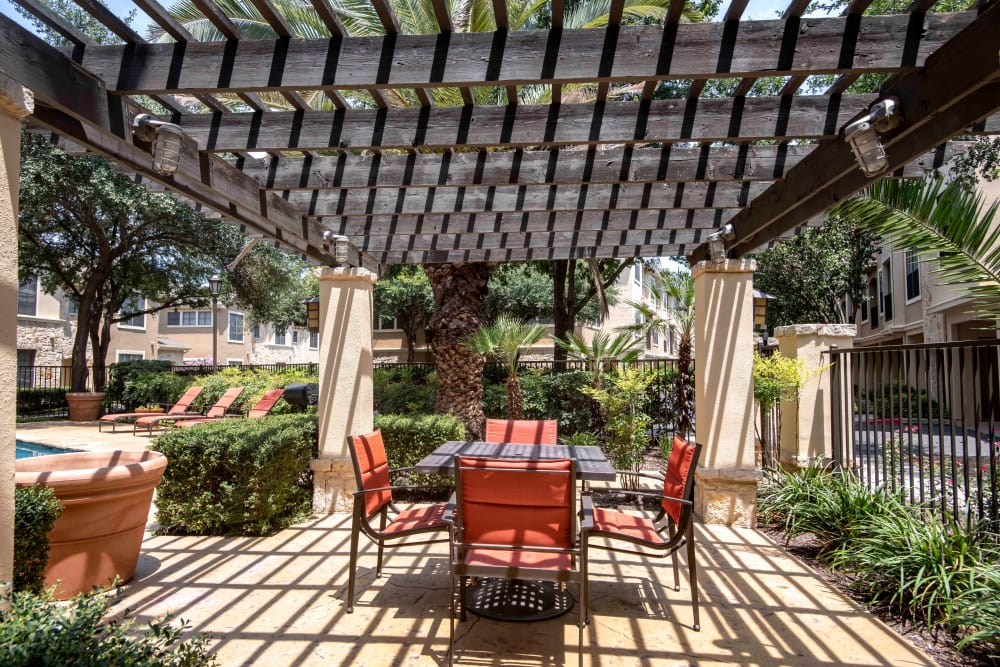Outdoor Lounge area by the pool at The Quarry Townhomes in San Antonio, Texas
