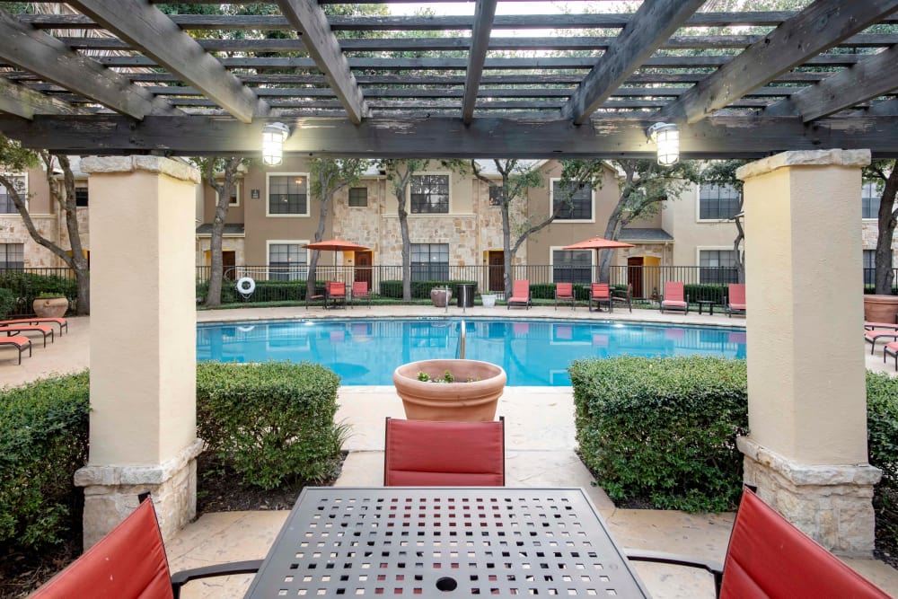 Gorgeous swimming pool with areas to relax at The Quarry Townhomes in San Antonio, Texas