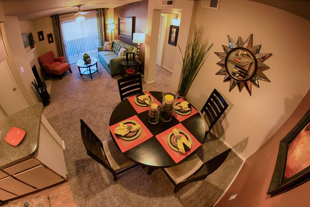 Separate dining room with kitchen table and view of kitchen and living room at The Abbey at Hightower in North Richland Hills, Texas