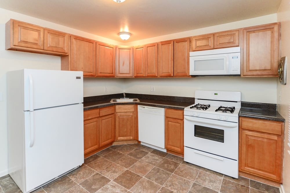 Kitchen with white appliances in Dover, Delaware