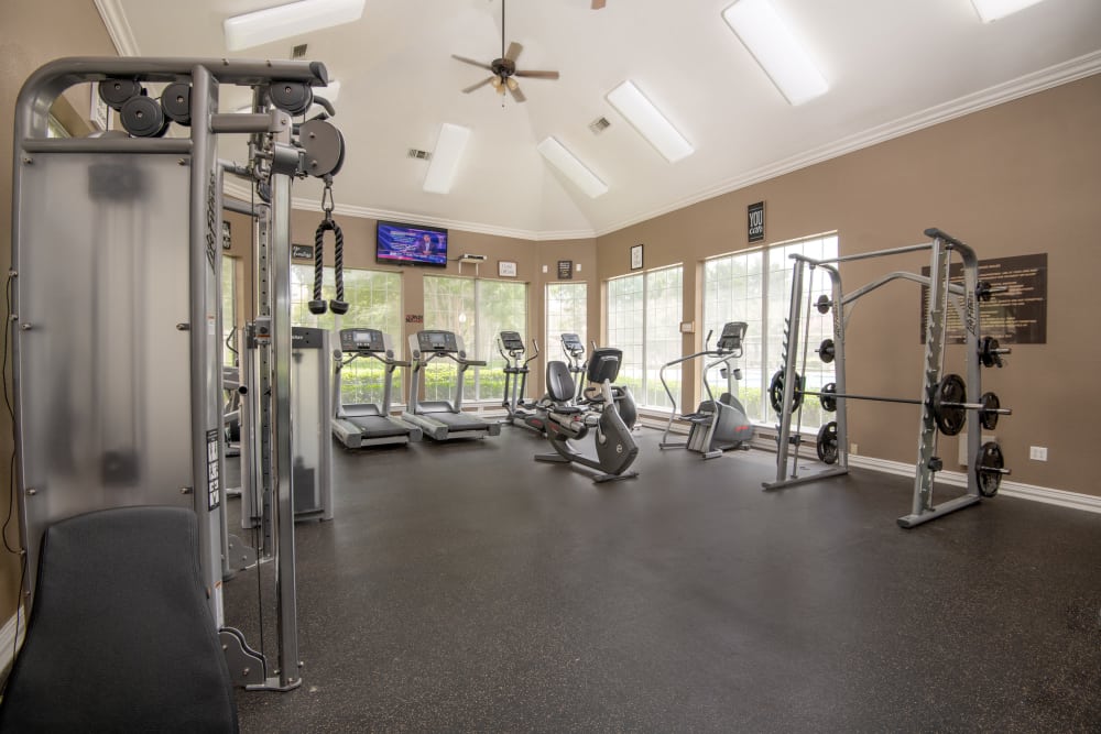 Well equipped fitness center at Ballantyne Apartments in Lewisville, Texas