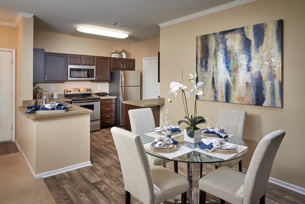 Kitchen overlooking the dining room at Legend Oaks Apartments in Aurora, Colorado