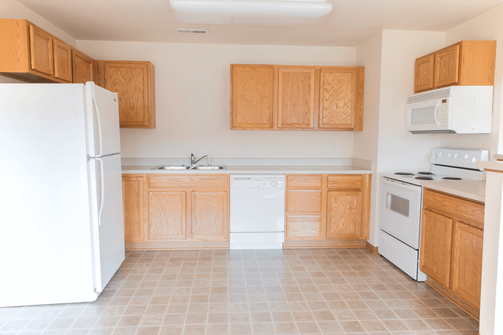 An apartment kitchen with tile flooring at West Towne in Ames, Iowa