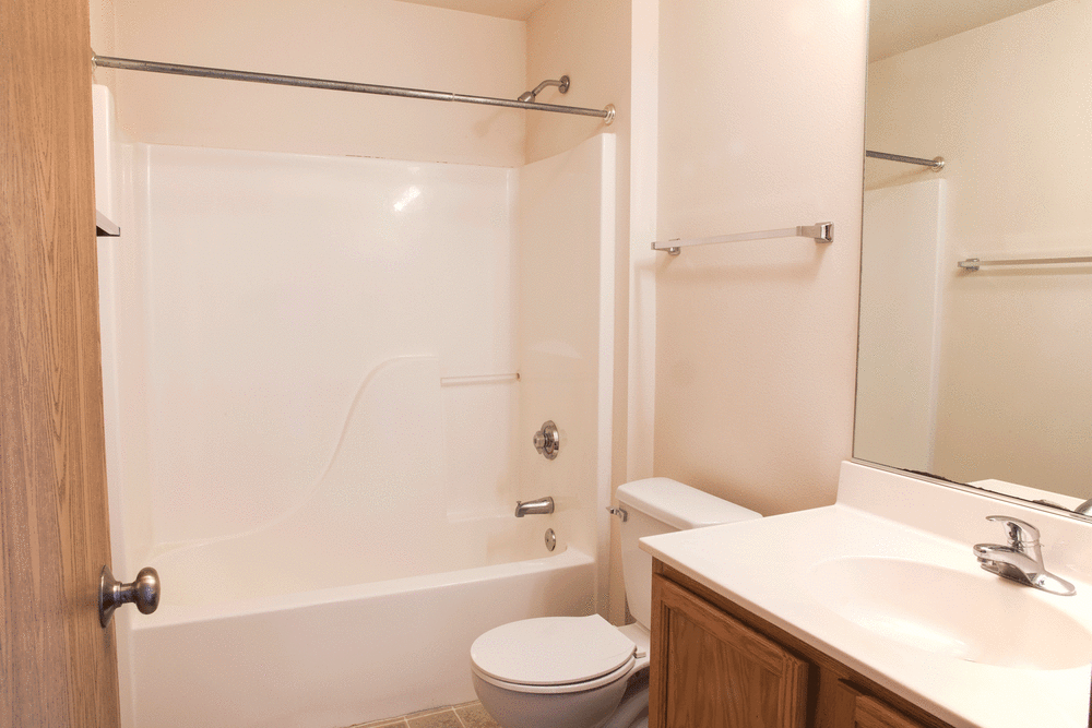 An apartment bathroom with a bathtub at West Towne in Ames, Iowa