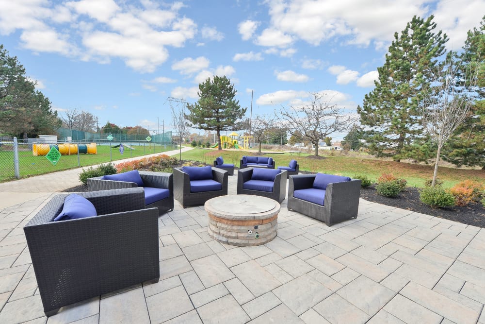 Outdoor lounge area with a fire pit at Abrams Run Apartment Homes in King of Prussia, Pennsylvania