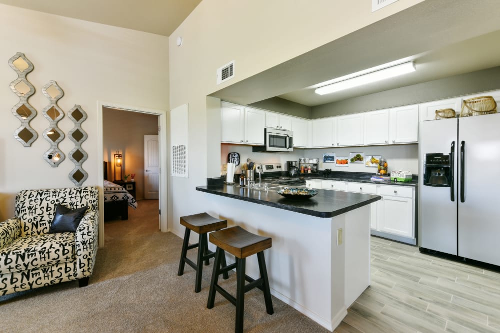 Kitchen with plenty of cabinet space at Cottages at Abbey Glen Apartments in Lubbock, Texas