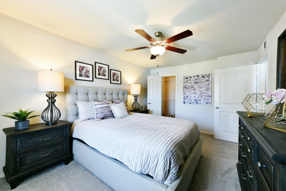 A well decorated bedroom at Cottages at Abbey Glen Apartments in Lubbock, Texas