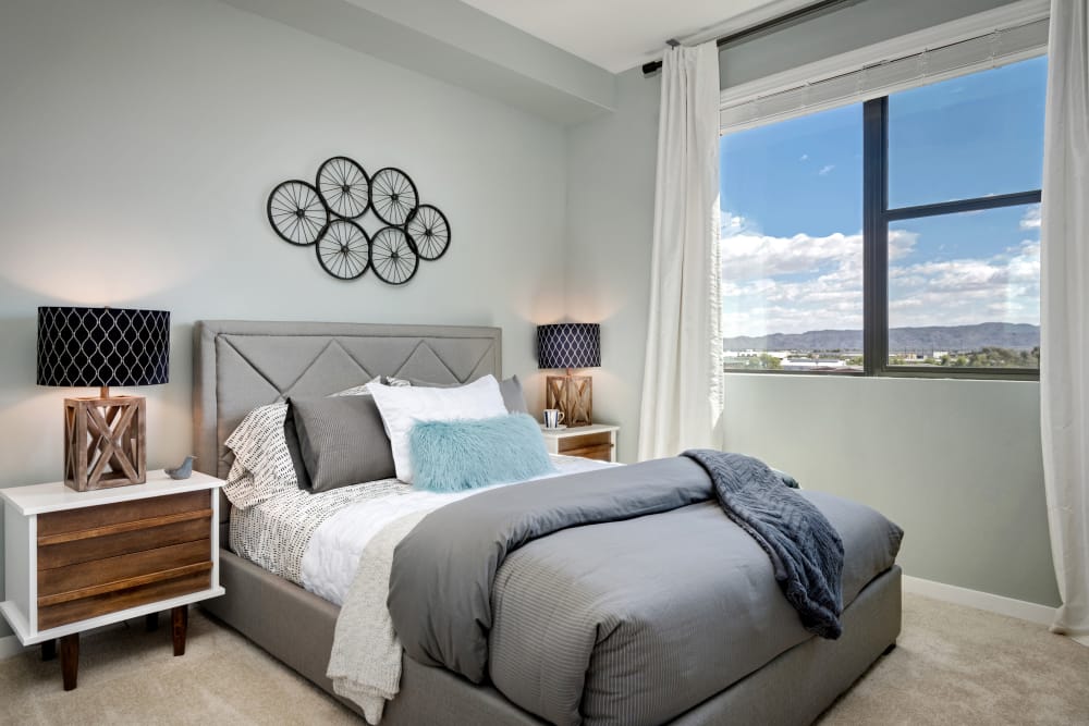 Large master bedroom with beautiful furnishings in model home at Capital Place in Phoenix, Arizona
