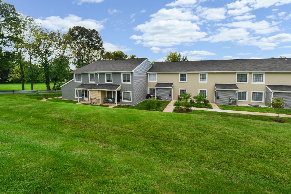Exterior and park-like setting at Montgomery Woods Townhomes in Harleysville, Pennsylvania