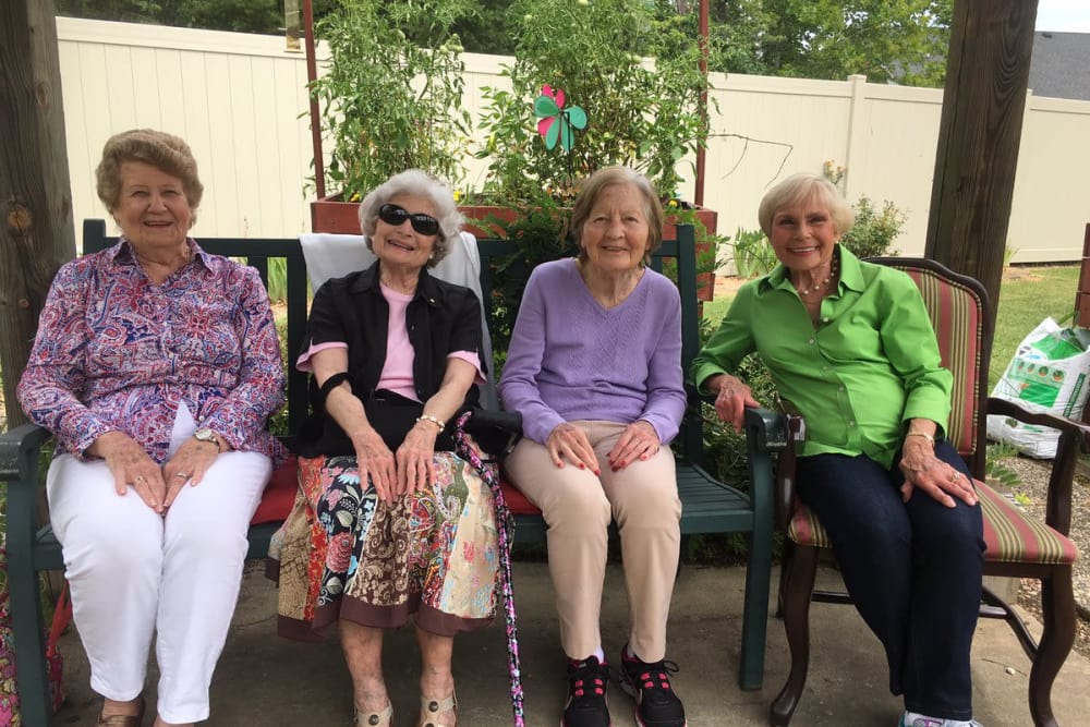 A group of residents sitting on the patio at The Oaks at Northpointe in Zanesville, Ohio