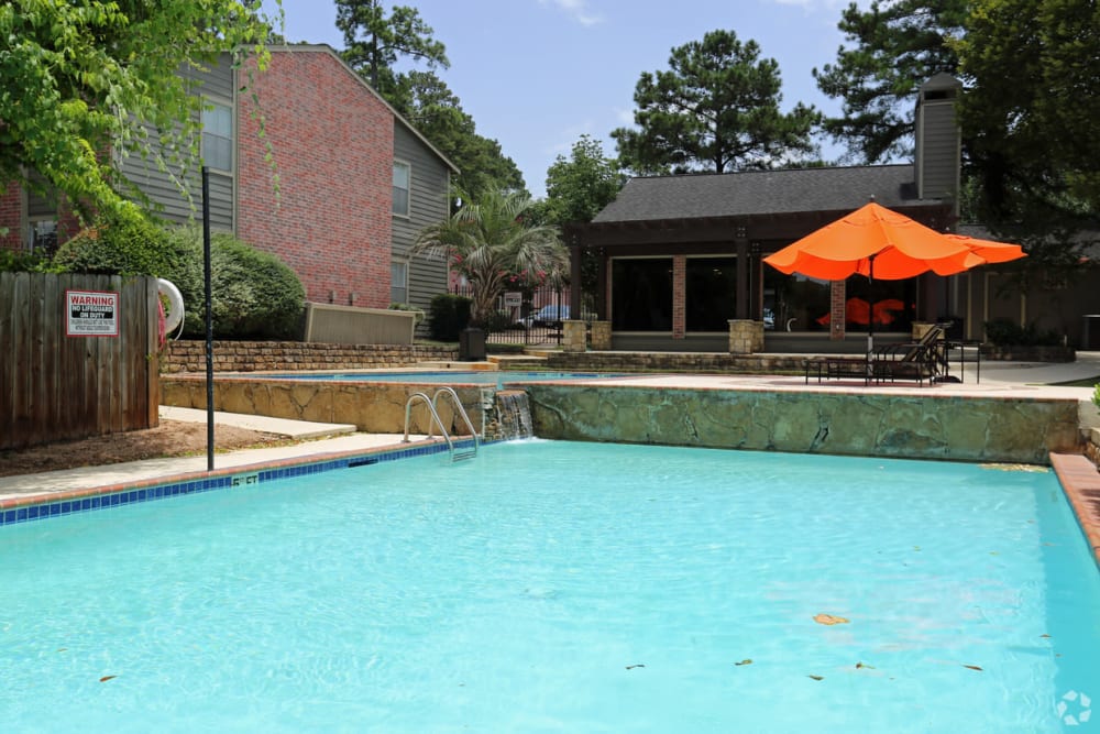 Swimming pool at Woodcreek Apartments in Huntsville, Texas