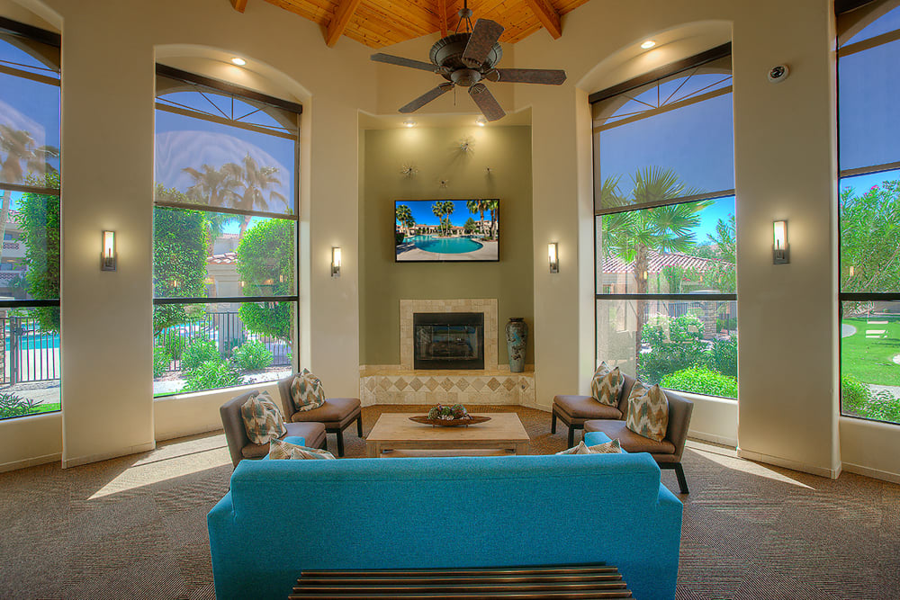 Luxurious clubhouse with a TV and fireplace at San Pedregal in Phoenix, Arizona