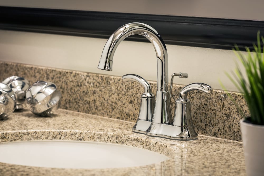 Stainless steel kitchen sink with granite counter tops at San Posada in Mesa, Arizona