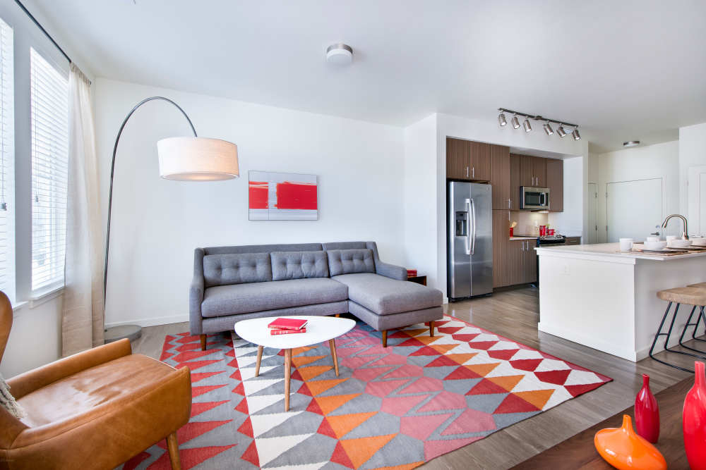 Living room and kitchen with island at Elevate in Englewood, Colorado