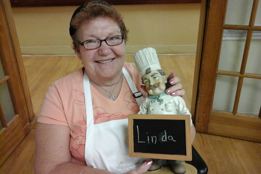 A resident with a chef statue at Highland Oaks Health Center in McConnelsville, Ohio