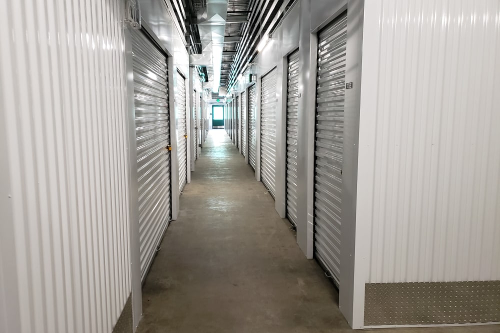 Well-lit hallways at Cascade Self Storage in Roseburg, Oregon