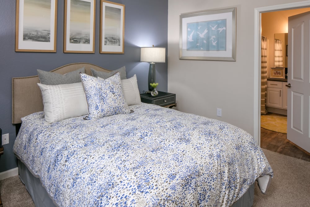 Spacious master bedroom with a walk-in closet at Cortland Village Apartment Homes in Hillsboro, Oregon