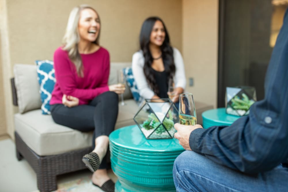 Resident taking in the view from her private balcony at Domus in Phoenix, Arizona
