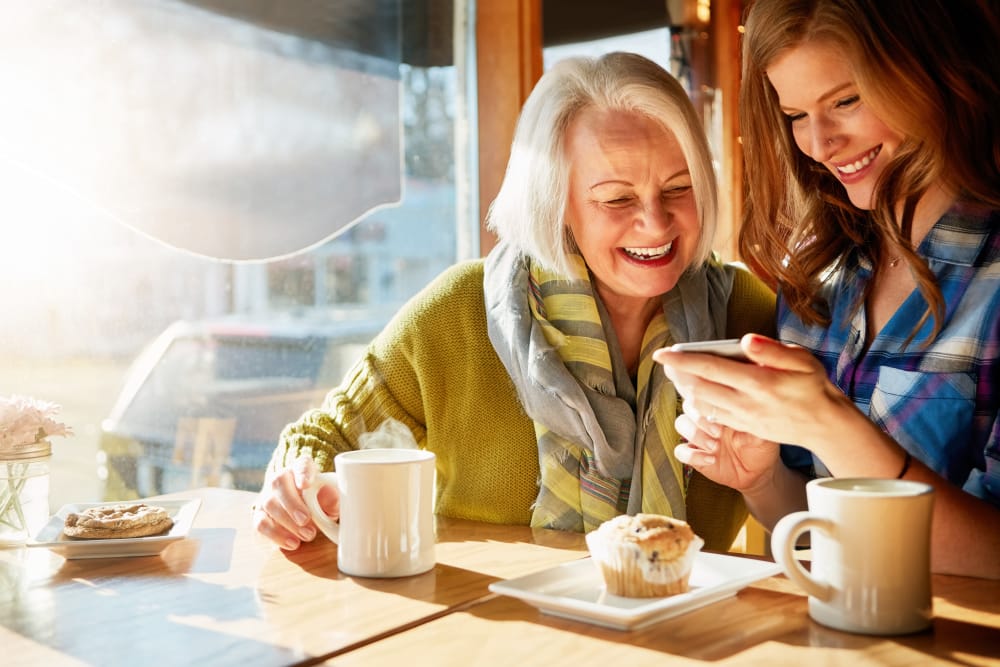 Friends enjoying coffee together in Orange City, Florida near Villa Grande on Saxon