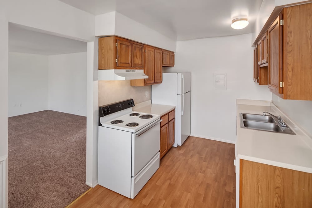 Ana apartment kitchen with wood flooring at Concorde Club Apartments in Romulus, Michigan