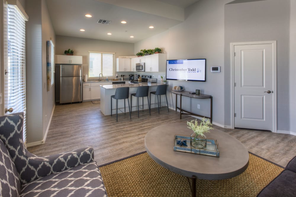 Beautiful open-concept floor plan with hardwood floors in model home at Christopher Todd Communities at Country Place in Tolleson, Arizona