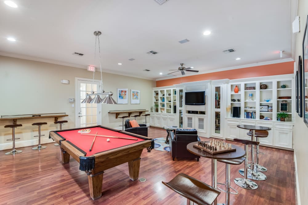 Clubhouse with a Pool Table at Ravinia Apartments in Spring, Texas