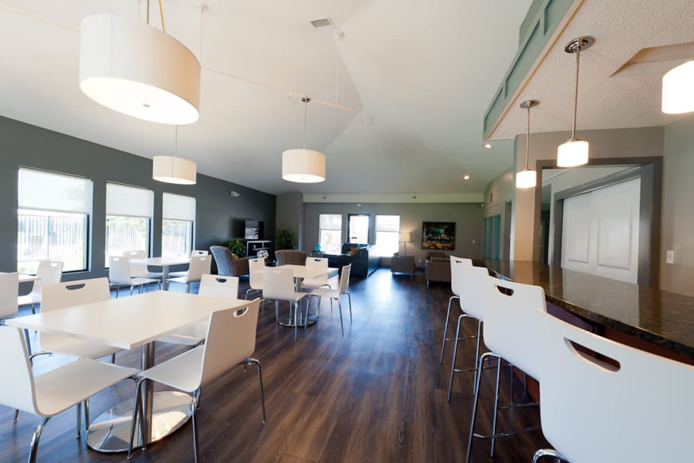 A clubhouse with lovely wood flooring at Pointe West Apartment Homes in West Des Moines, Iowa