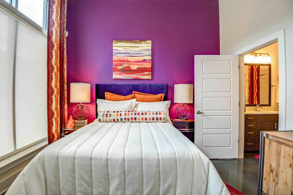 Bedroom with accent wall at Mercury NoDa in Charlotte, North Carolina