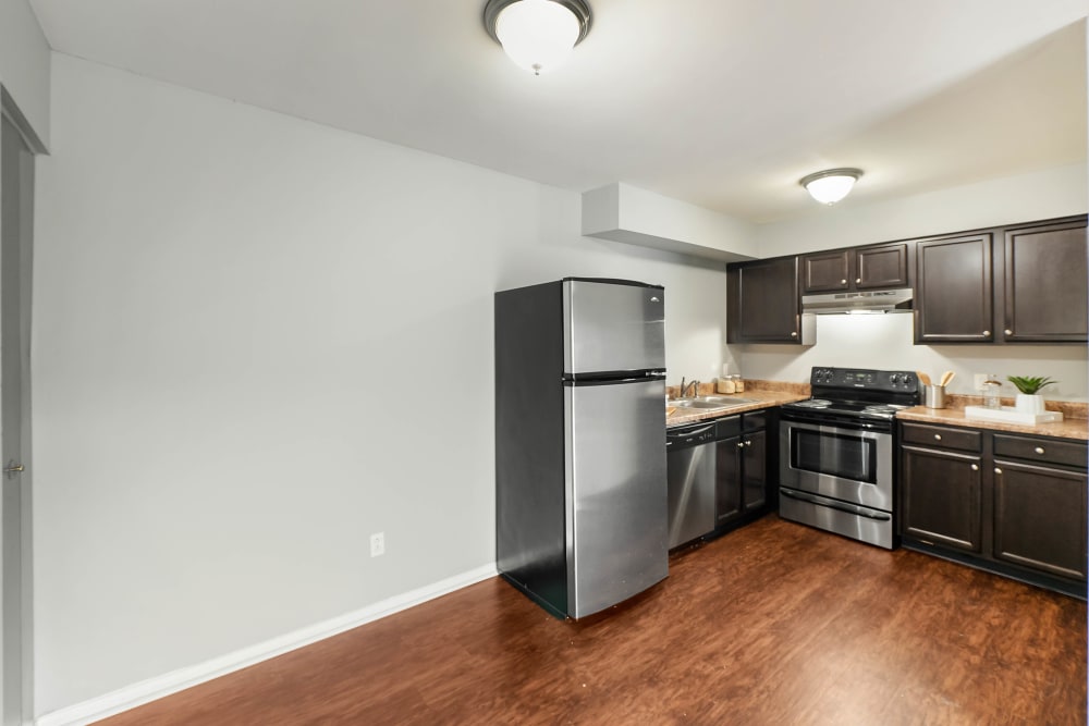Kitchen with nice hardwood-style floors at The Reserve at Red Bank Apartment Homes in Chattanooga, Tennessee