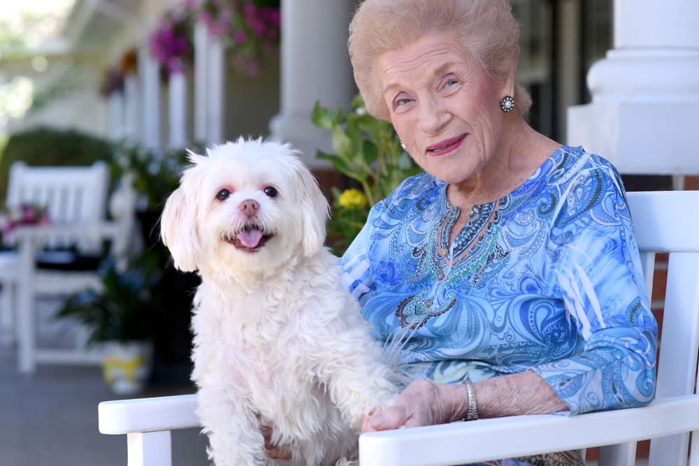 Senior with dog on lap