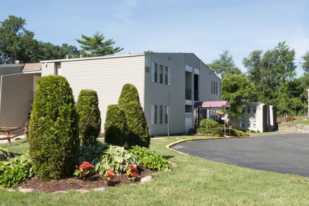 Leasing office with a large lawn at Laurel Hill Apartments in Lindenwold, New Jersey