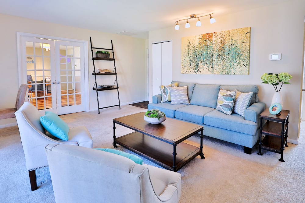Spacious model living room at Cedar Creek Apartment Homes in Glen Burnie, Maryland