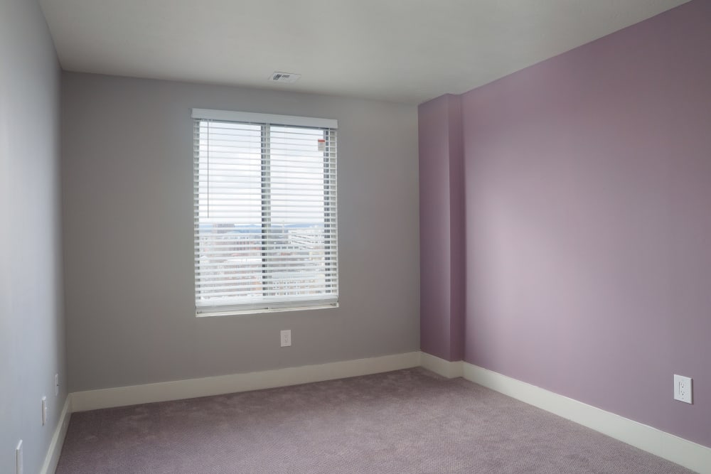 Bedroom with a pretty purple wall and a window at Element 250 in Hartford, Connecticut