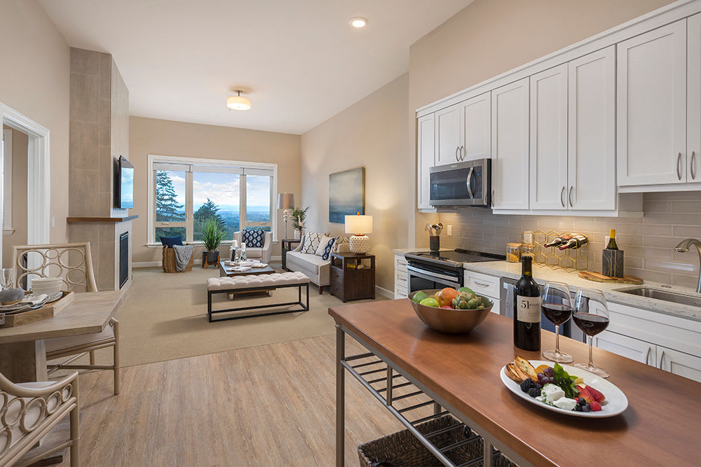 An apartment kitchen leading to the living room at Touchmark in the West Hills in Portland, Oregon