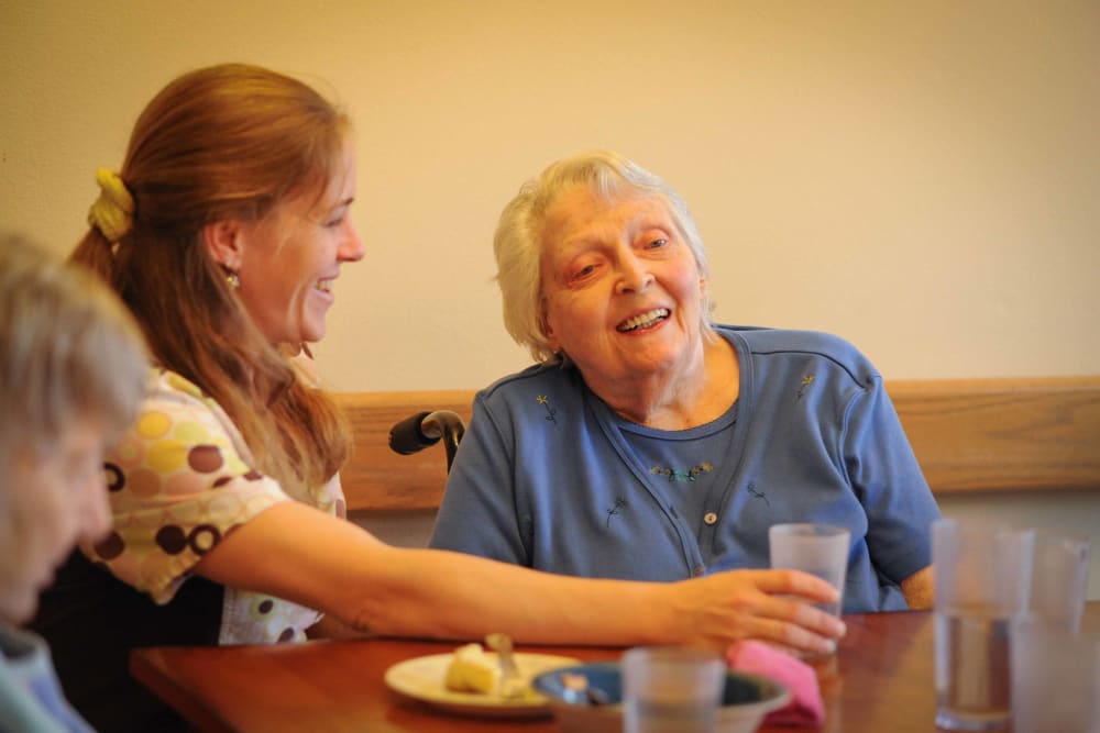 A senior having breakfast with their caretaker at Chandler House in Yakima, Washington