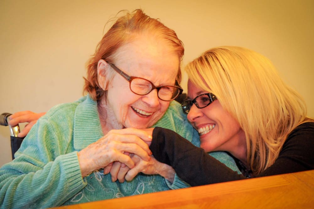 A caretaker hugging her patient at Chandler House in Yakima, Washington