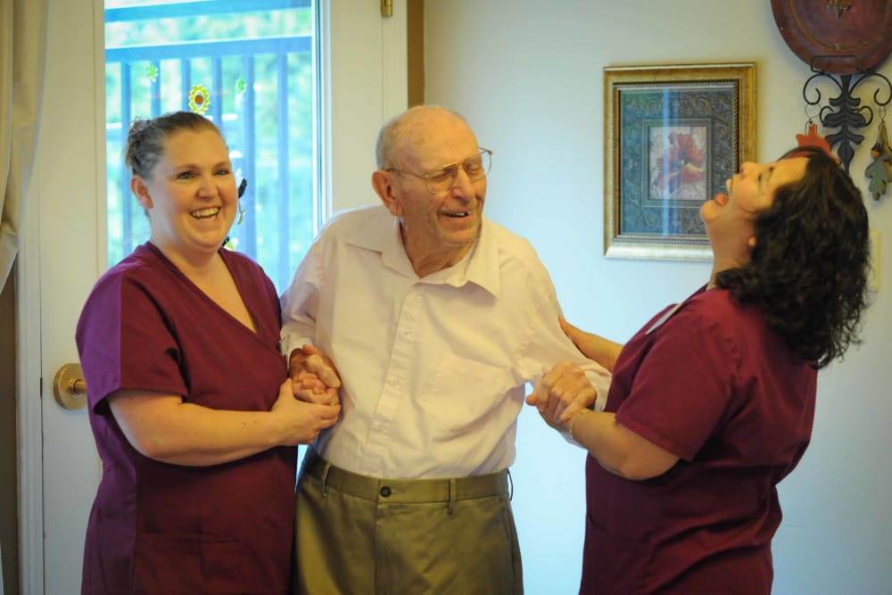 Two ladies laughing with a patient at Chandler House in Yakima, Washington