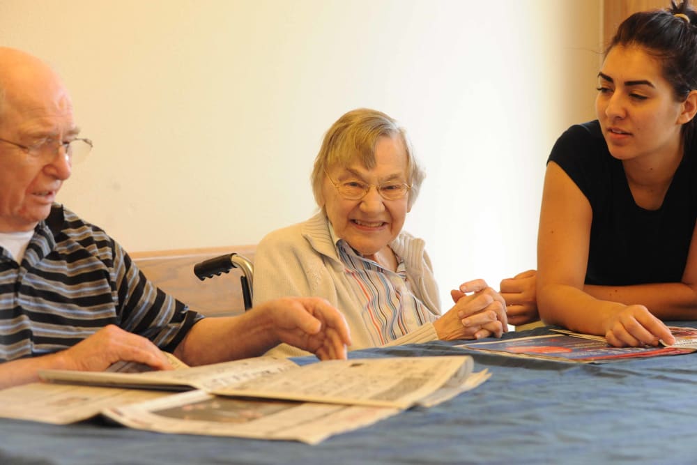 A few seniors at Chandler House in Yakima, Washington reading the newspaper