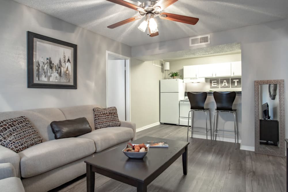 Model living room and bar seating at Willowick Apartments in College Station, Texas