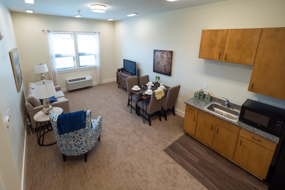 Living room and kitchen in senior apartment in Pear Valley Senior Living in Central Point, Oregon