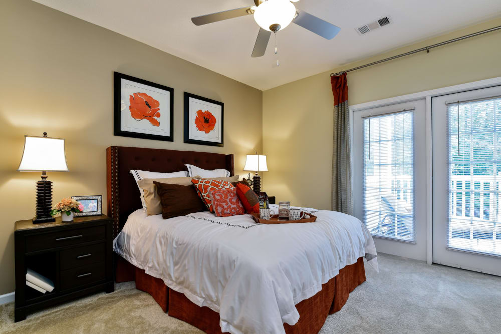 Master bedroom with a patio at Lullwater at Bass in Macon, Georgia
