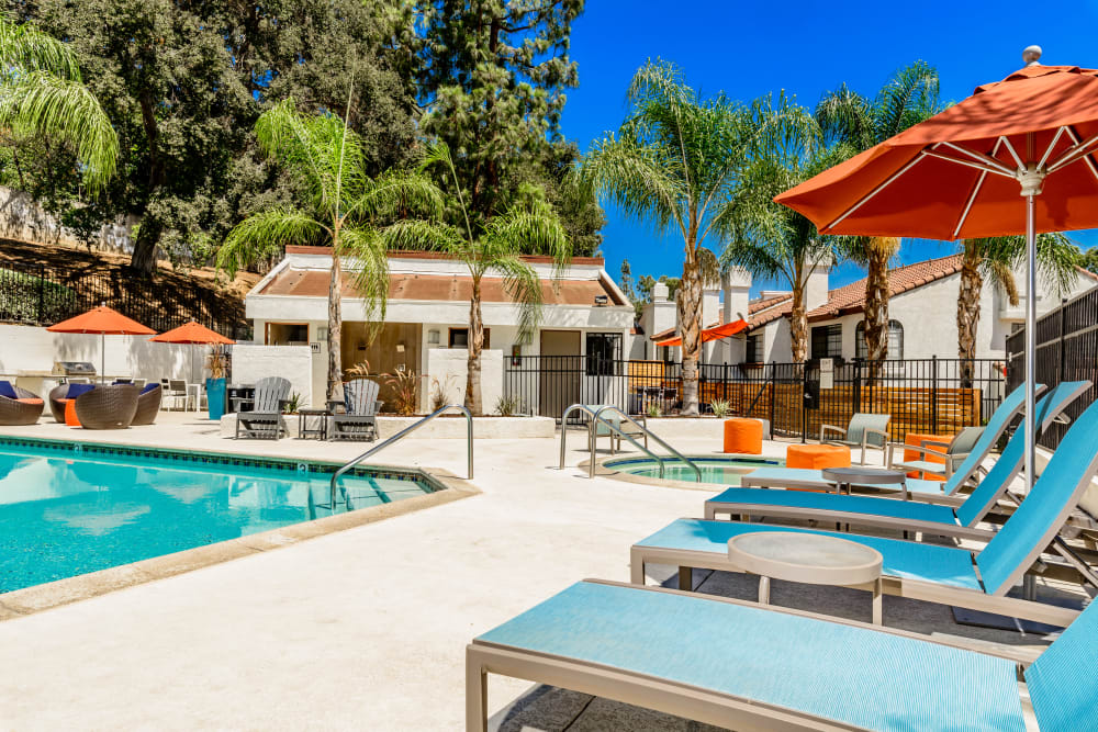Poolside lounge chairs at Sonora at Alta Loma in Alta Loma, California