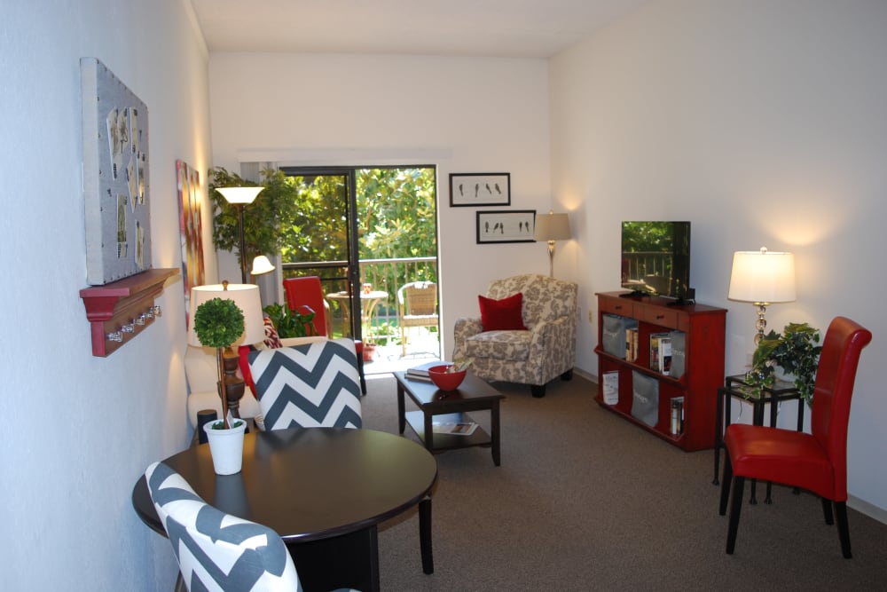 Model living room with patio access at Pasadena Highlands in Pasadena, California
